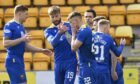 The St Johnstone players celebrate with Callum Hendry.