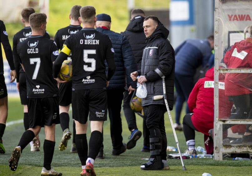 Arbroath's Chris Hamilton was pictured on crutches at full-time.