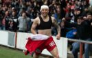 A delirious Matej Poplatnik celebrates after Raith Rovers' SPFL Trust Trophy win