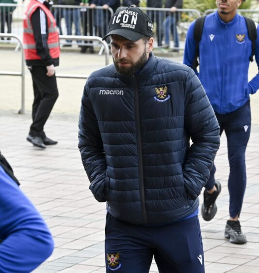 St Johnstone's Nadir Ciftci arrives at Celtic Park to watch from the stand.