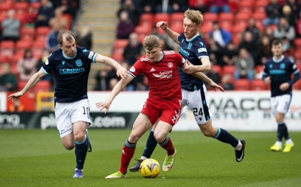 Dundee's Paul McGowan and Max Anderson get to grips with Aberdeen full-back Jack MacKenzie.