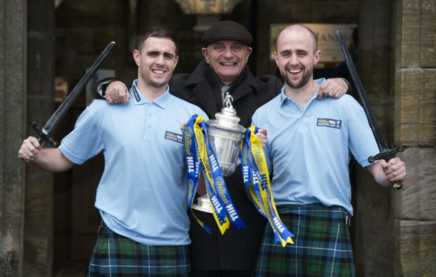 Ross Campbell alongside brother Iain and dad Dick pictured in 2013 for a Scottish cup publicity shot.
