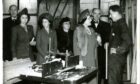 The late Queen Mother visiting the factory with her daughters Princess Elizabeth and Princess Margaret