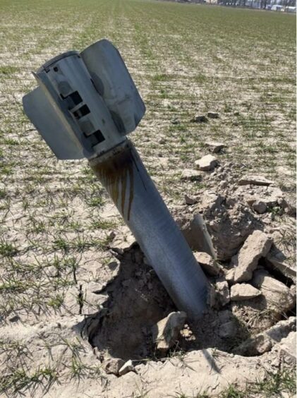 A farmer's photo of an unexploded missile in a Ukrainian field sent to Allen.