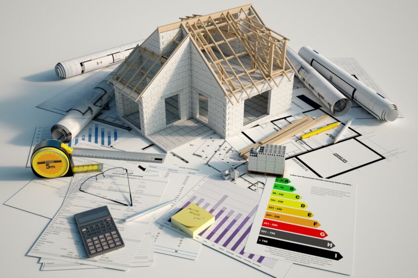 A picture of a house renovation model and drawings