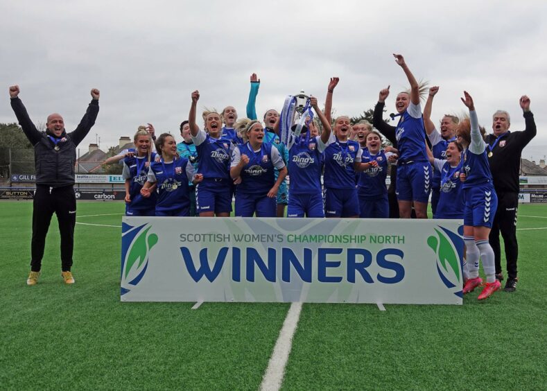 the Montrose FC Women's team celebrate their SWF Championship title win.