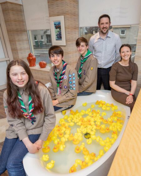 Scouts Emily McGregor, Jamie Gorton and Cameron Anderson with Richard Fraser and Fiona Lowry of The Bathroom Company.