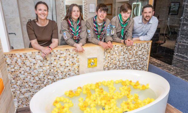 Scouts Emily McGregor, Jamie Gorton and Cameron Anderson with Fiona Lowry and Richard Fraser from The Bathroom Company.