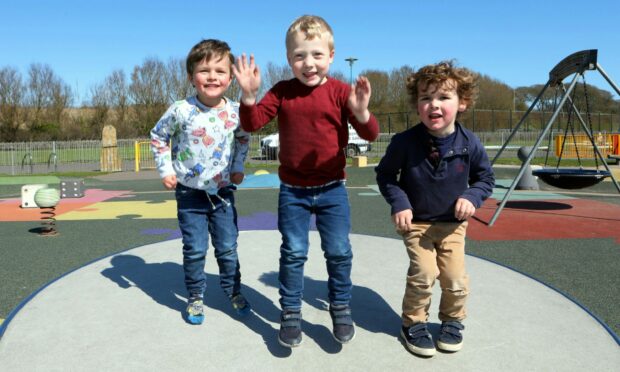Oliver Hall, 3, Isaac MacPherson, 4, and Michael Stirling, 4, all enjoy the sun in Arbroath.