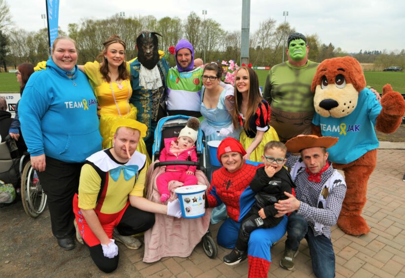 Kinsley at the event with fundraisers in fancy dress