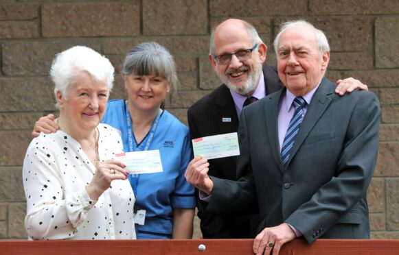 Ron and Sheenah Cargill with specialist nurse Carolyn Webber representing NHS Tayside MND Endowment Fund and Stan Ure of MND Scotland. Pic: Gareth Jennings/DCT Media.