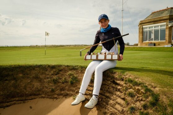 Grace Crawford with the Helen Holm Trophy.