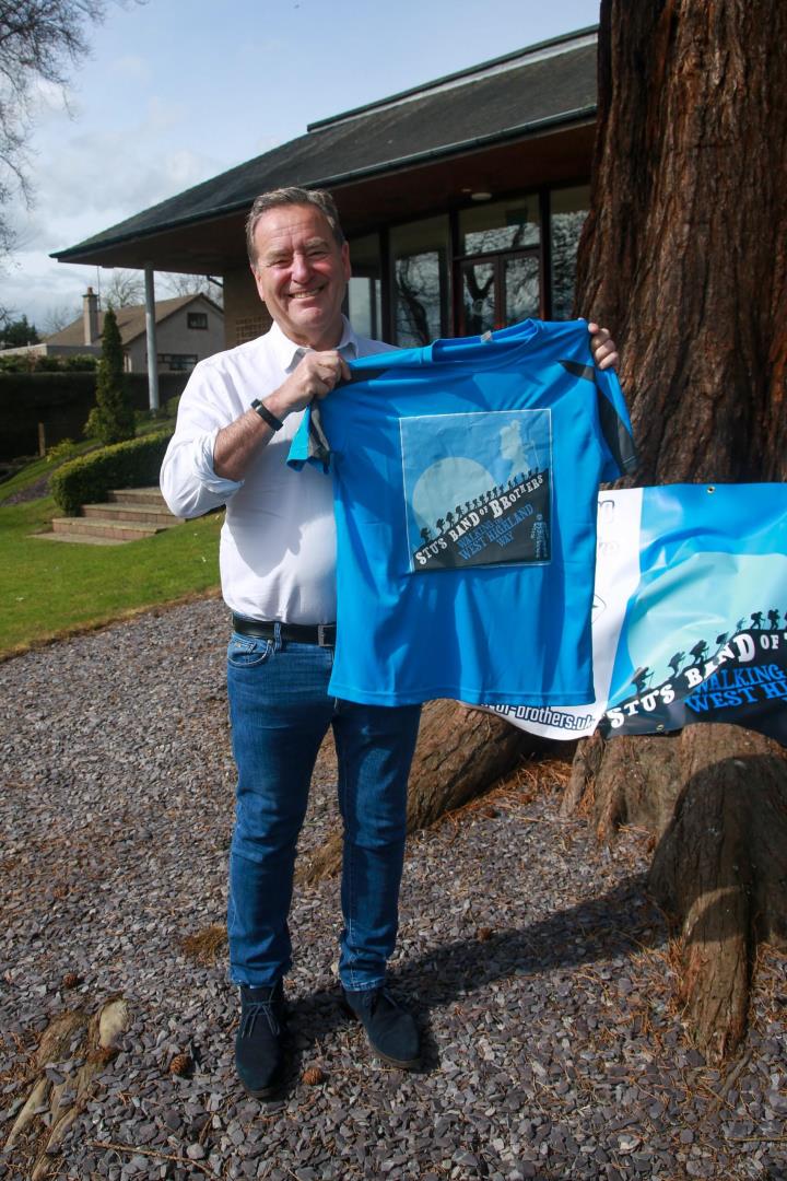 Stelling with one of the challenge's t-shirts.