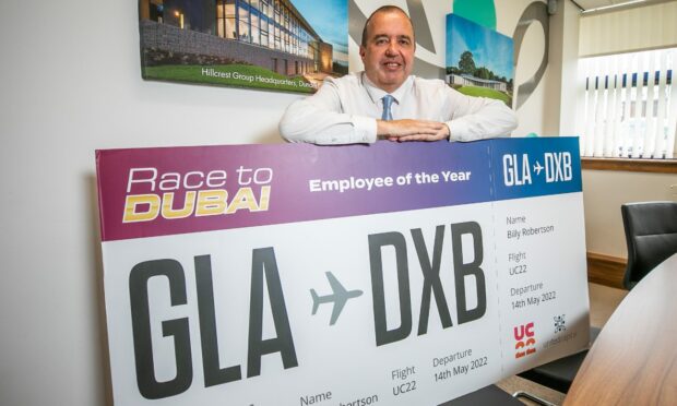 Dundee worker Billy Robertson has won a trip to Dubai after being named employee of the year.