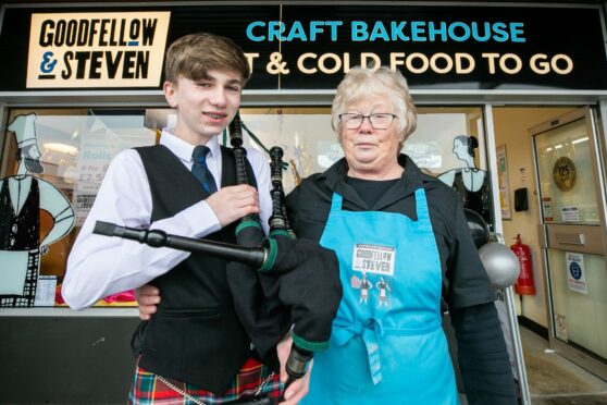 Young piper Finlay Liddell surprised manager Moira Curr on her final day at Goodfellow and Steven. Pic: Kim Cessford/DCT Media.