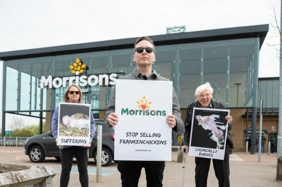 Protesters held placards demanding the supermarket withdraw "frankenchickens" from its shelves