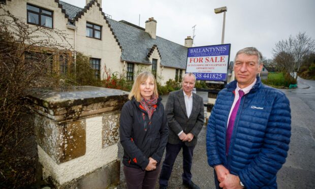 Campaigner Sally Murray, Pete Wishart MP and Councillor Mike Williamson outside the former hospital building.