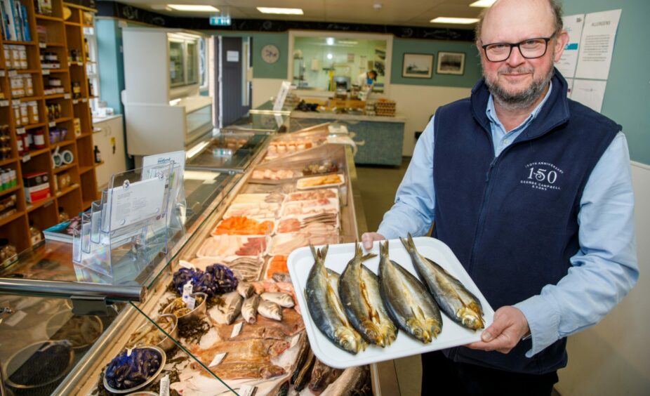 Iain pictured inside the deli shop.