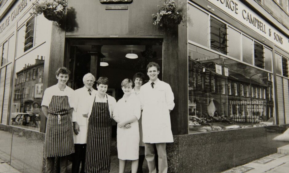Managing director Iain Campbell (right) pictured with other staff members outside the old Stafford Street Shop in Edinburgh.