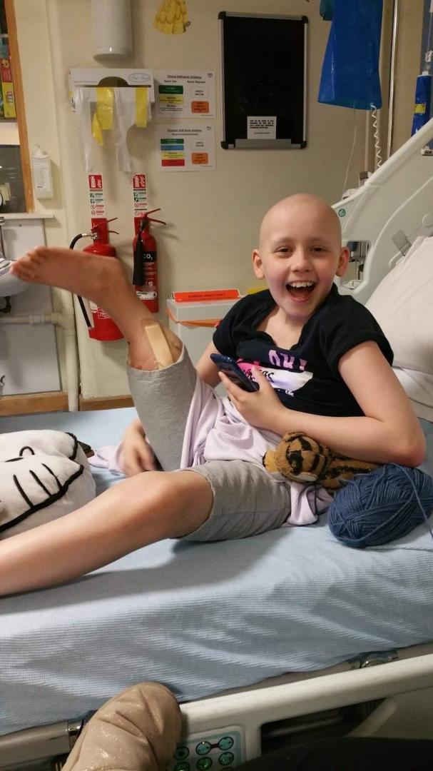 Katie Pake in hospital following the operation on her right leg. Supplied by Cancer Research UK.
