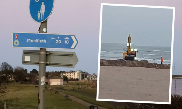 A digger was spotted on the popular beach on Tuesday.