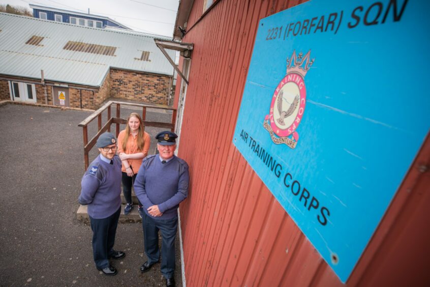 Sergeant Stuart McAllan, left, and Flying Officer Stuart Archibald with civilian instructor Aine McHaffie at the Brechin Road squadron HQ. Pic: Steve MacDougall/DCT Media.