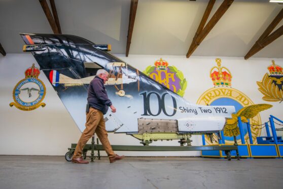 MAHSC chairman Stuart Archibald passes the Tornado tail fin now on display at Montrose. Pic: Steve MacDougall/DCT Media.