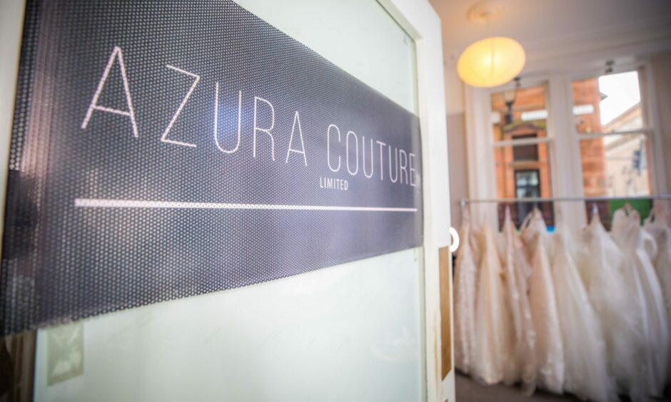 A sign that says Azura Couture leading into the bridal shop.