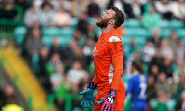 St Johnstone goalkeeper Zander Clark's reaction to another Celtic goal being scored sums up frustrations.