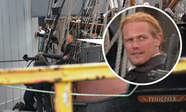 Sam could be seen grinning on board the ship