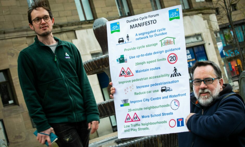 Dundee Cycle Forum chair Russell Pepper and vice chair David Martin with the manifesto in City Square.