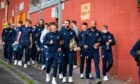 Dundee players and staff walk to Tannadice earlier this season.