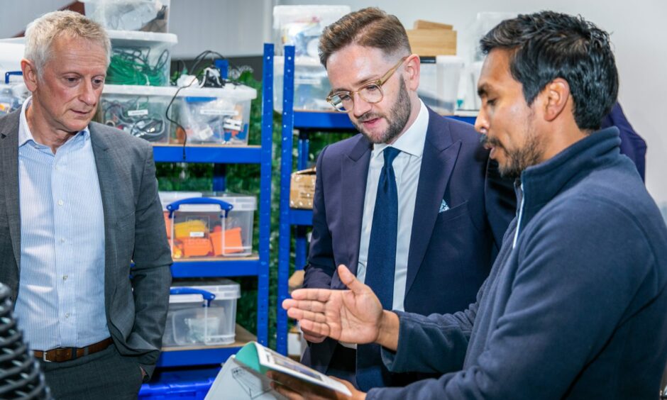 Dr Faisal Ghani of SolarisKit discusses the S400 Solar Collector with Greig Coull - CEO Michelin Scotland - and Chris Stark.