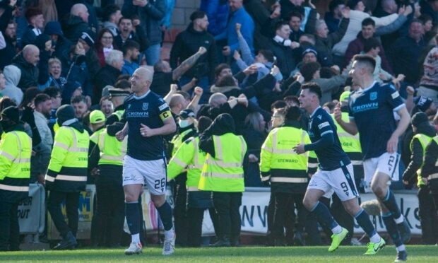 Dundee players celebrate after Charlie Adam levelled the scores against Dundee United