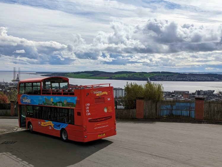 Xplore Dundee open-top tour driving by Tay River