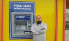 Iftakhar Yaqub with the damaged cash machine.