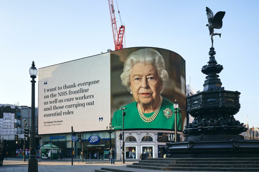 The Queen on a billboard in Piccadilly circus at the height of the pandemic. 