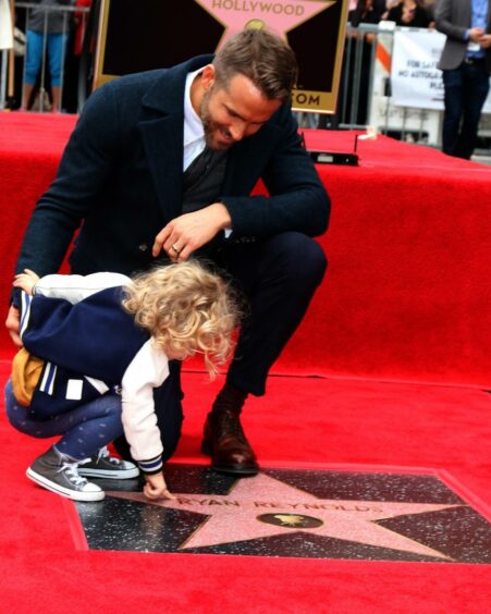 Actor Ryan Reynolds and his daughter James.