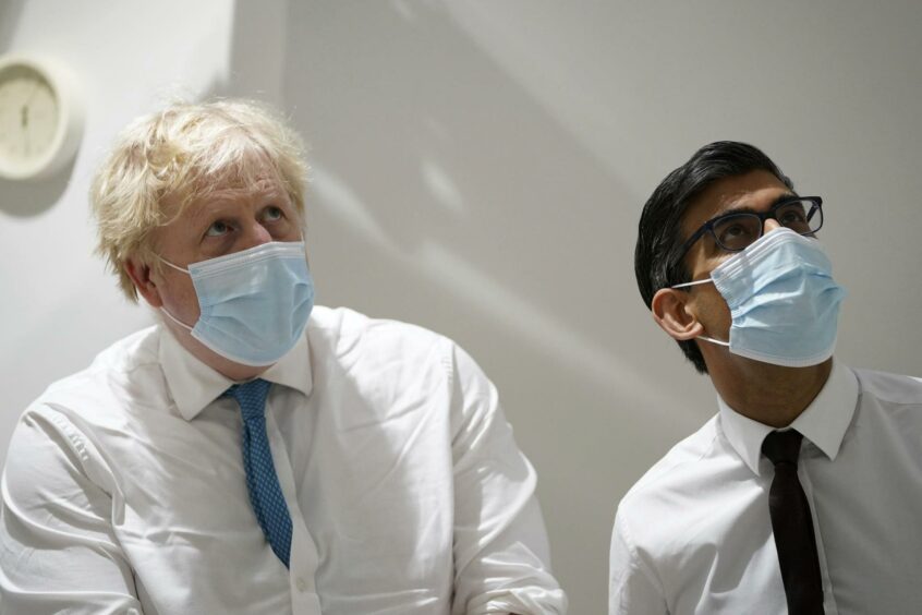 Boris Johnson and Rishi Sunak on a hospital visit earlier this year. Photo: Gareth Fuller/AP/Shutterstock.