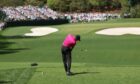 Tiger Woods hits his tee shot on the fourth hole during the first round of the Masters.