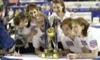 Jackie Lockhart celebrates winning gold with her team-mates in 2002.