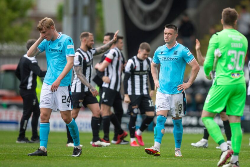 Dundee players dejected at full-time.
