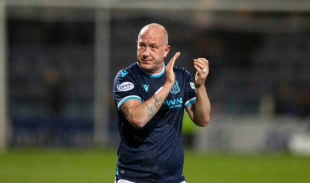 A tearful Charlie Adam applauds Dundee fans at Dens Park after beating Hibs.