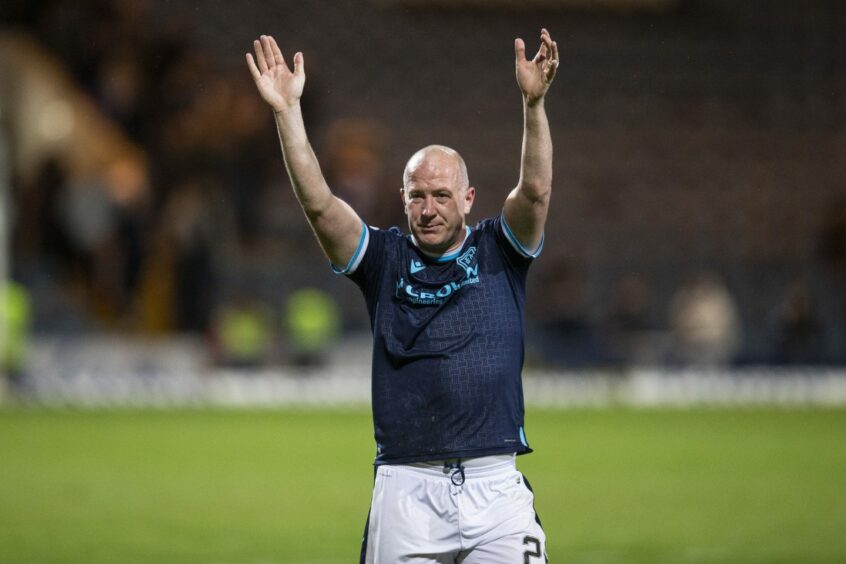 Charlie Adam waves farewell to the Dundee supporters at Dens Park. Image: David Young/Shutterstock.