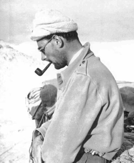 David Stirling, widely credited with founding the SAS, in the desert with his pipe, circa 1942. 