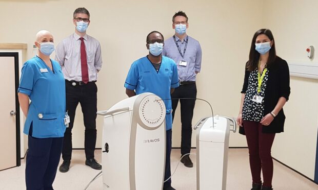 NHS Tayside staff in Dundee with the new cancer treatment technology