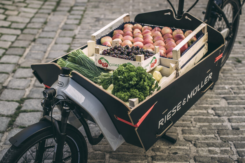 e cargo bike full of fruits in the city 