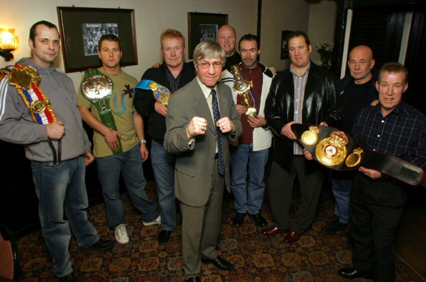 The Lochee Sports Bar, Dundee, where Ken Buchanan MBE is pictured with Jimmy Fraser, far right.