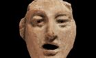 A terracotta model of an actor's mask, part of the Troy exhibition at The McManus.