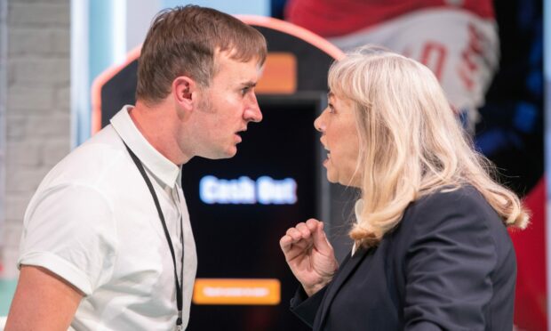 Ewan Donald and  Irene Macdougall share a tense moment in The Bookies at Dundee Rep.